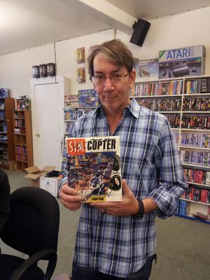 Will Wright with a copy of Sim Copter